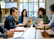 Co-workers interacting in workspace