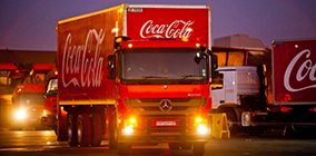 Coca-Cola delivery truck at night 3/4 view facing camera