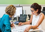 Two co-workers collaborating on data