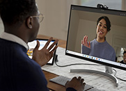 Man and woman have video conference via Microsoft Teams